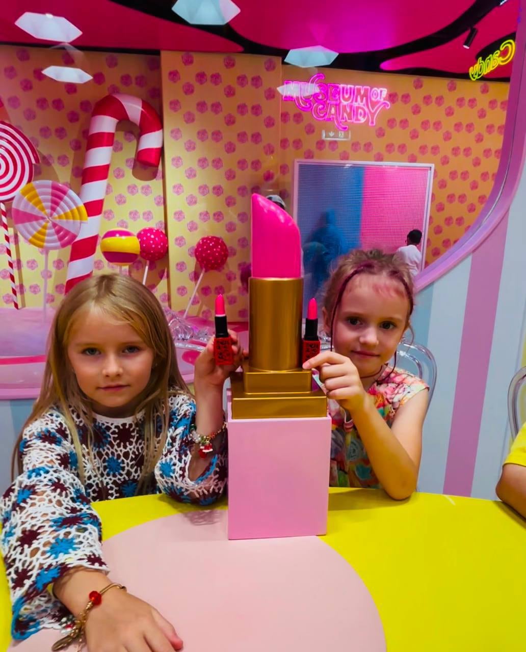 Children holding their handmade lipsticks at Museum of Candy